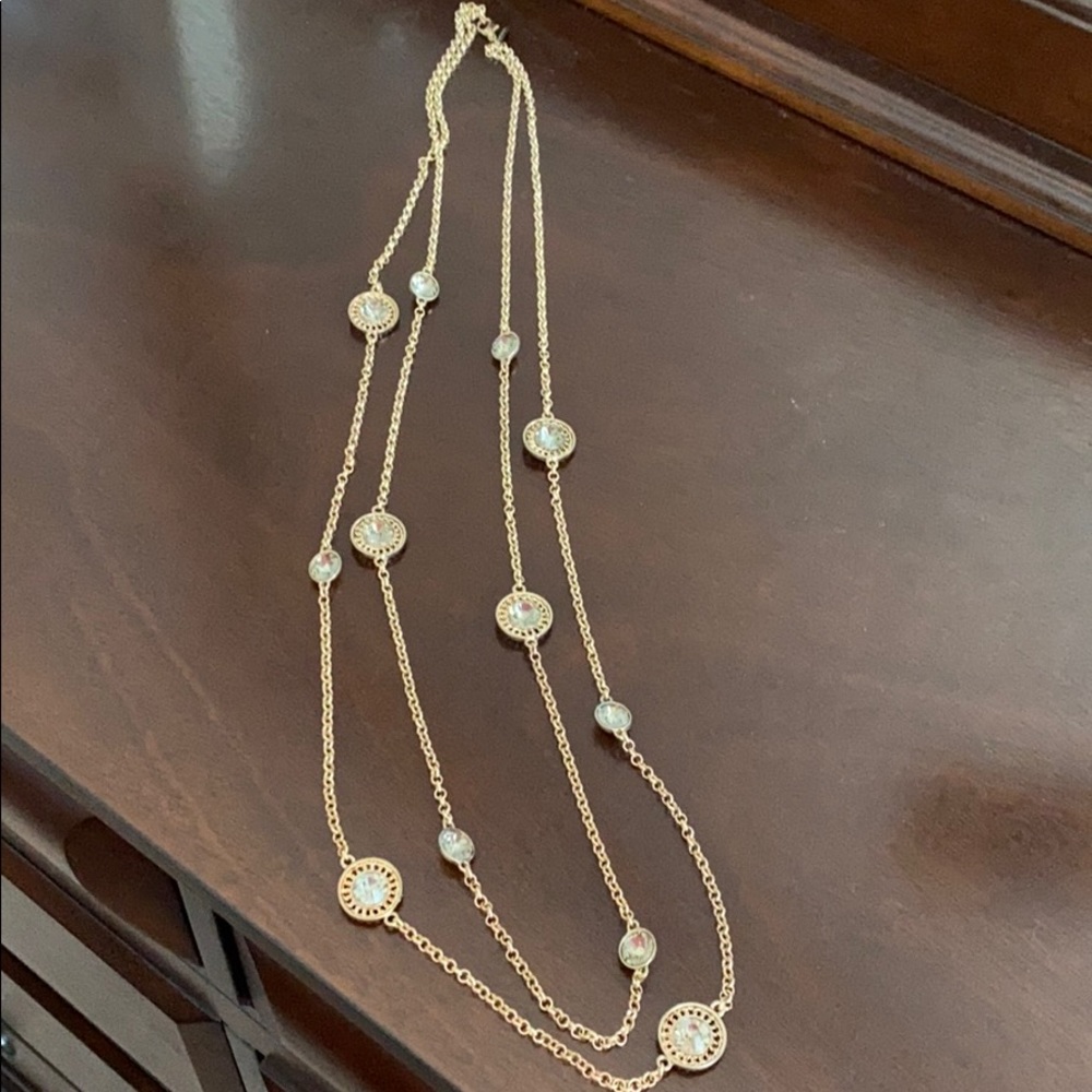 Like new long necklace in antique gold.